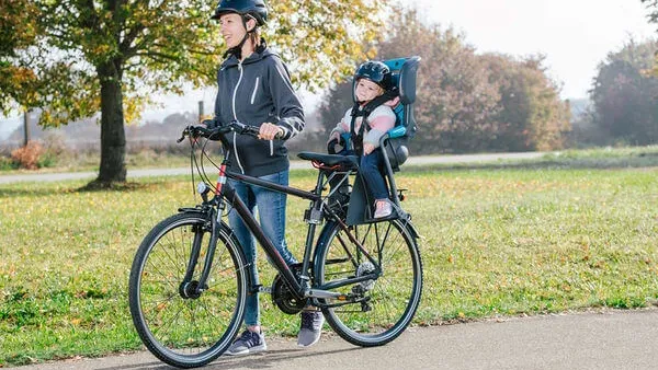 parent cycling an infant