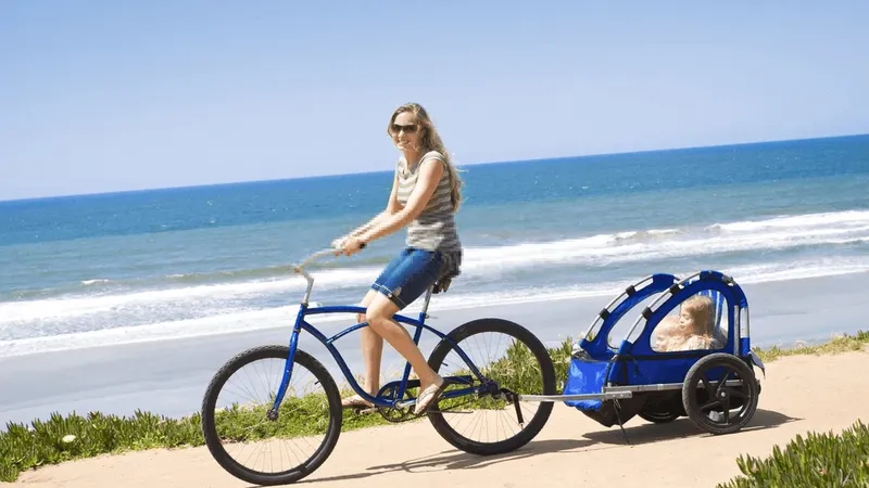 Kids on a bike trailer during summer